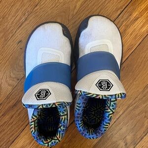 Kids White and Blue Nike Slip-On Sneakers